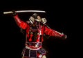 Samurai in ancient armor with a sword attack