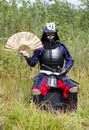 Samurai in armor with fan