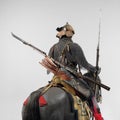 Samurai armor on a horse figurine isolated on gray surface background