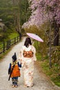 samurai boy and Kimono mother with sakura Royalty Free Stock Photo