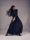 Samurai, sword and japanese woman fighter, ninja or warrior swing to fight for power, cosplay and fantasy. Asian female Royalty Free Stock Photo