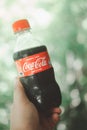 Samut Prakan, Thailand - August 2, 2020 : Coca-Cola plastic bottle size mini. Coca Cola is the most popular carbonated soft drink Royalty Free Stock Photo