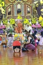 SAMUT PRAKAN, THAILAND-FEBRUARY 22 : Magha Puja Day. Traditional buddhist people are lighting candles for religious ceremonies