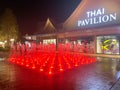 Samut Prakan, Thailand - January 1, 2020 : Thai Pavilion and light fountain at night in the newly open premium outlet mall locates
