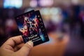 Samut Prakan, Thailand - July 2, 2022: Man hand holding Thor Love and Thunder collection card, a promotion from Major Cineplex