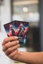 Samut Prakan, Thailand - June 26, 2022: Man hand holding tow card of Thor Love and Thunder collection from Major Cineplex