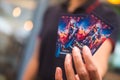 Samut Prakan, Thailand - June 25, 2022: Woman show a Movie ticket of Thor Love and Thunder collection card show at July 6, 2022