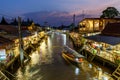 Samut Songkhram / Thailand - April 21 2018: Twilight view Amphawa market canal and Many People as tourists walking, shopping.