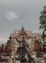 Black Nezha guardian deity sculpture and Thao wessuwan sculptures