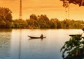 Samuth Songkram, Thailand April 18, 2017: Man rowing a small wooden boat, life along the river.