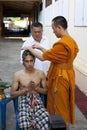 SAMUTPRAKAN THAILAND-MARCH 23:Thai monk shaving hair of a man who prepares to be new monk at wat paichayonpolsepratchaworawihan o