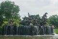Samutprakarn / Thailand - Ausust 12 2019: handicraft sculpture of ancient god with strong horses decorated on waterfall in Ancient