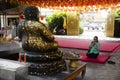 Thai old woman visit and respect praying Katyayana or Gautama Buddha at Wat Chong Lom