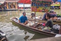 Unacquainted Thai people Selling local Food on the boat in Amphawa Floating market in holiday time