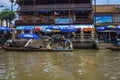 Unacquainted Thai people and tourists come to visit Amphawa Floating market in holiday time.