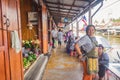 Unacquainted Thai people and tourists come to visit Amphawa Floating market in holiday time.