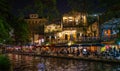 San Antonio river walk patios lit up at night. Royalty Free Stock Photo