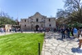 SAN ANTONIO, TEXAS - MARCH 2, 2018 - People get in line to visit the historical Alamo Mission, built in 1718 and site of the famou Royalty Free Stock Photo