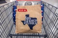 SAN ANTONIO, TEXAS - NOVEMBER 9, 2018 - Shopping cart with H-E-B reusable shopping bag with the Texas state outline and the words