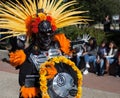 SAN ANTONIO, TEXAS - OCTOBER 29, 2017 - Masked man wears feather deaddress and costume dances at the celebration of Dia de Los Mu
