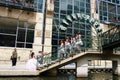 San Antonio, Texas, U.S - April 6, 2024 - A group of young teenagers in Quinceanera party taking pictures the bridge of the Shops