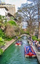 San Antonio, TX - March 16, 2008: Tourists and locals along the city river on a boat tour Royalty Free Stock Photo