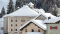 San Bernardino, Switzerland. The roofs of houses covered with fresh snow after heavy snowfall. Mountain and winter contest