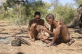 San Bushmen starting a fire Royalty Free Stock Photo