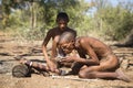 San Bushmen starting a fire Royalty Free Stock Photo