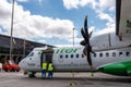 Propeller airplane provisioning on the runway, Los Rodeos