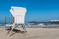 People Enjoy Pacific Beach Near Crystal Pier and Lifeguard Station Royalty Free Stock Photo