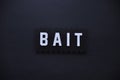 Bait logo on the dark wall