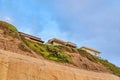 San Diego California mountain with homes against blue sky and clouds background Royalty Free Stock Photo