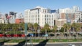 SAN DIEGO, CALIFORNIA USA - 13 FEB 2020: MTS red trolley and metropolis urban skyline, highrise skyscrapers in city downtown. From