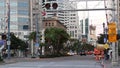 SAN DIEGO, CALIFORNIA USA - 13 FEB 2020: Pedestrians, traffic and highrise buildings in city downtown. Street life of american