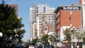 SAN DIEGO, CALIFORNIA USA - 13 FEB 2020: Pedestrians, traffic and highrise buildings in city downtown. Street life of american