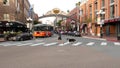 SAN DIEGO, CALIFORNIA USA - 30 JAN 2020: Gaslamp Quarter historic entrance arch sign on 5th avenue. Orange iconic retro trolley, Royalty Free Stock Photo