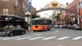 SAN DIEGO, CALIFORNIA USA - 30 JAN 2020: Gaslamp Quarter historic entrance arch sign on 5th avenue. Orange iconic retro trolley, Royalty Free Stock Photo