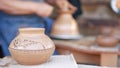 SAN DIEGO, CALIFORNIA USA - 5 JAN 2020: Potter working in mexican Oldtown, raw clay on pottery wheel. Man`s hands, ceramist in Royalty Free Stock Photo