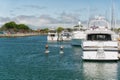 San Diego, Luxury Yachts in Embarcadero Marina Park and Attractive Women on Stand Up Paddle Boards