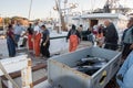 SAN DIEGO, USA - NOVEMBER 17, 2015 - fishing boat unloading tuna at sunrise Royalty Free Stock Photo