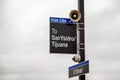 San Diego, USA, 05/04/2016: A sign indicating the direction to Tijuana, Mexico, at a train station against the sky