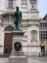 San Fedele square in Milan Italy with the statue of writer Alessandro Manzoni