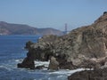 San Francisco Bay with Golden gate in the background and rocks in the front