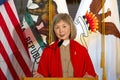 Claudine Cheng speaking at a Press Conference at City Hall for the annual unveiling of the commemorative Lunar New Year Stamp