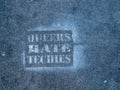 `Queers hate techies` graffiti on street in San Francisco