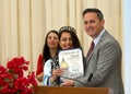 Supervisor Ahsha Safai presenting certificate of honor to Maryam Fasihy at a Nowruz celebration