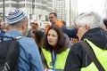 Unidentified organizers preparing for a March Against Anti-Semitism up Market Street to Civic Center