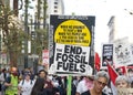 Participants holding signs marching and protesting APEC meeting in San Francisco, CA