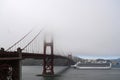 San Francisco, CA, USA - July 26, 2023: A cruise ship swims past the Golden Gate Bridge in a fog Royalty Free Stock Photo